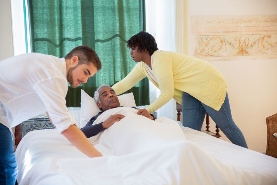 caregiver helping senior patient