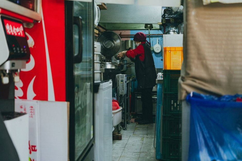 elderly korean person cooking kitchen