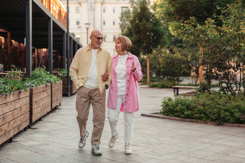 happy elderly couple walking park healthy