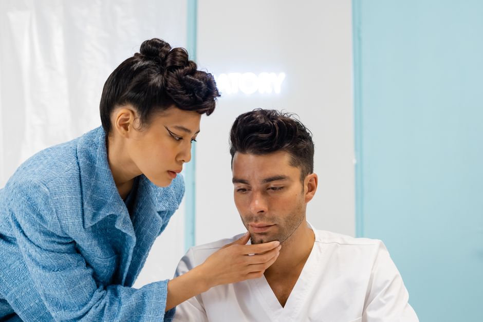 doctor examining patient skin