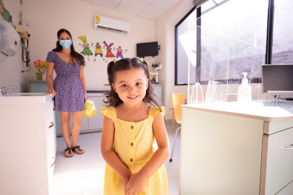 parent holding child at pediatric clinic