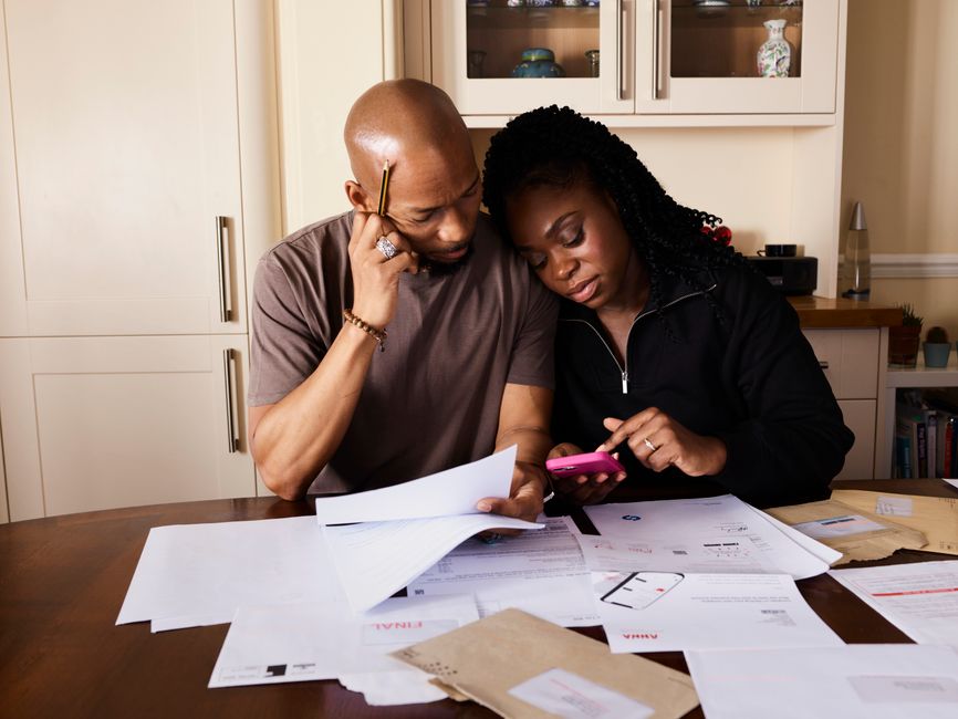 family checking electricity bill smartphone