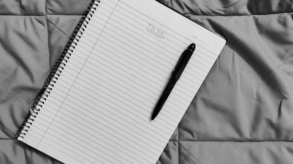 travel checklist notebook and pen