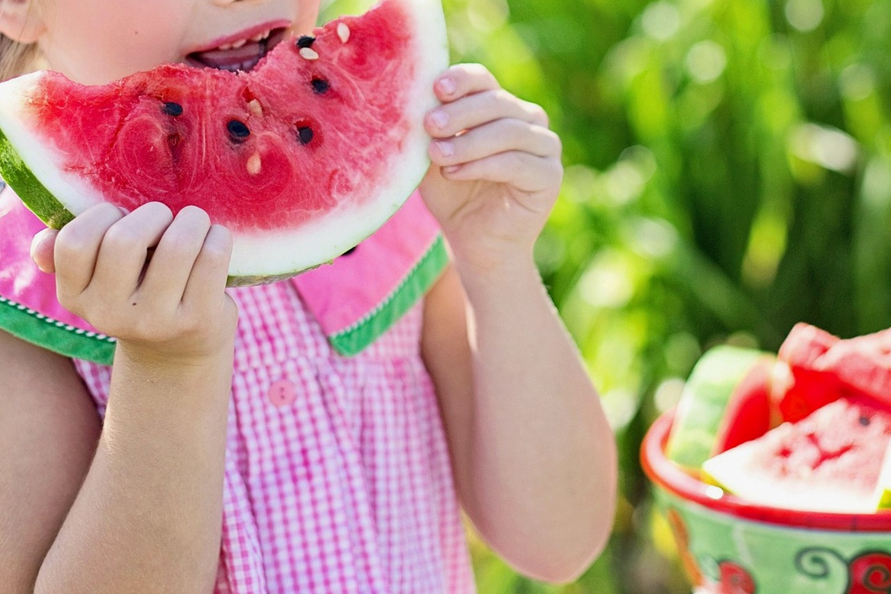 person eating healthy snack outdoors