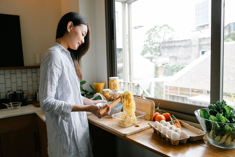 woman cooking healthy meal kitchen