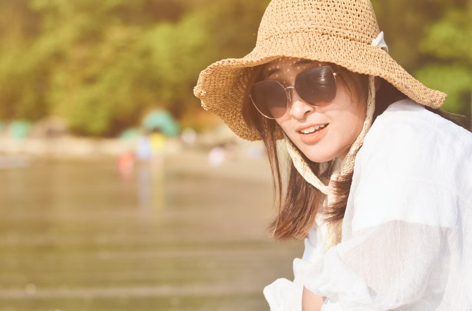 elderly wearing hat parasol outdoor