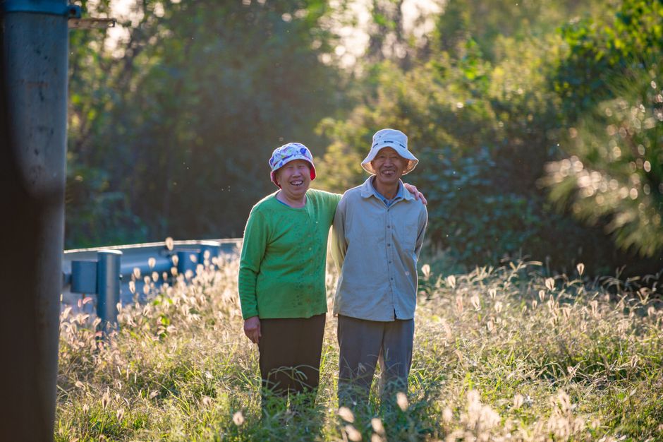 happy korean senior receiving pension