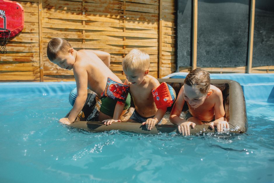 family cooling down summer home