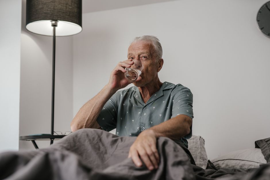 glass of water hydration elderly