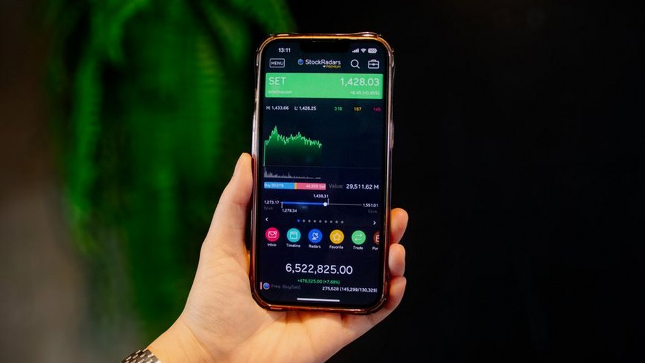 person checking investment app phone