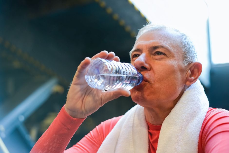 elderly couple drinking water staying hydrated summer