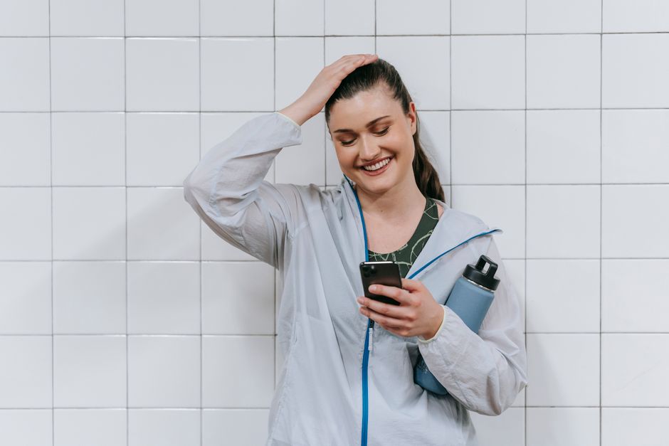 relieved person with phone smiling