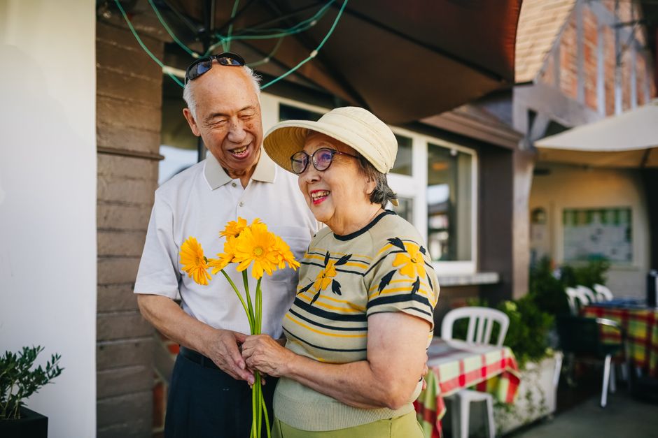 senior citizen smiling outdoors happy