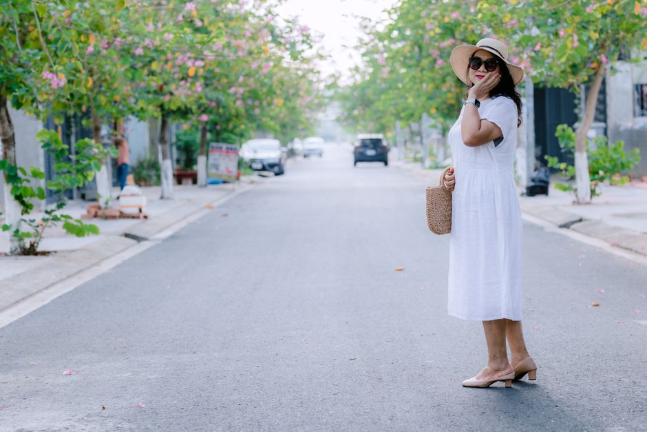 woman wearing hat walking shade summer