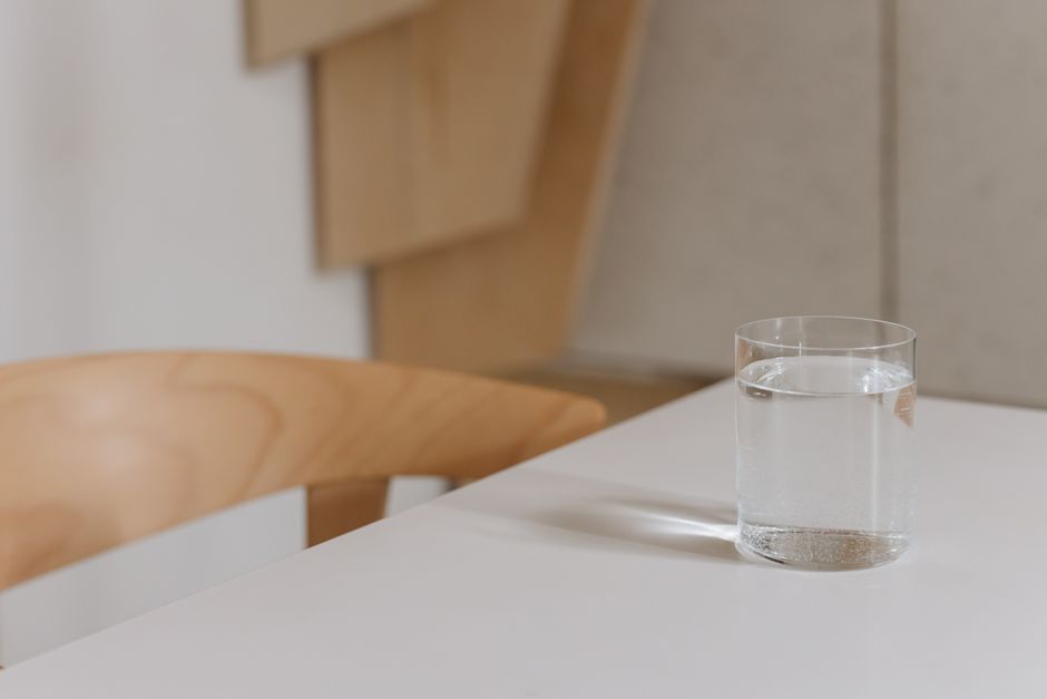 glass of water on wooden table