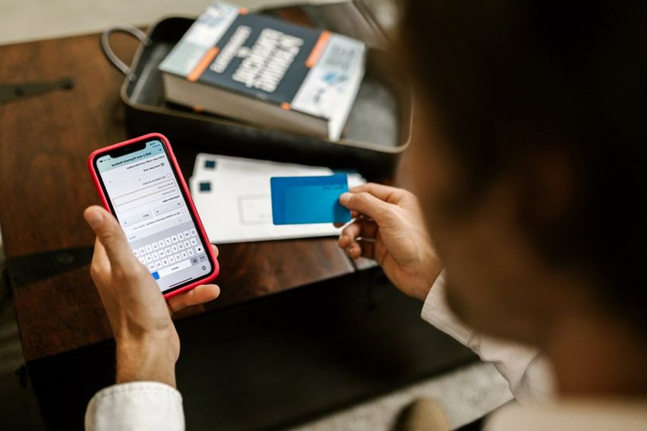 person checking bank app smartphone