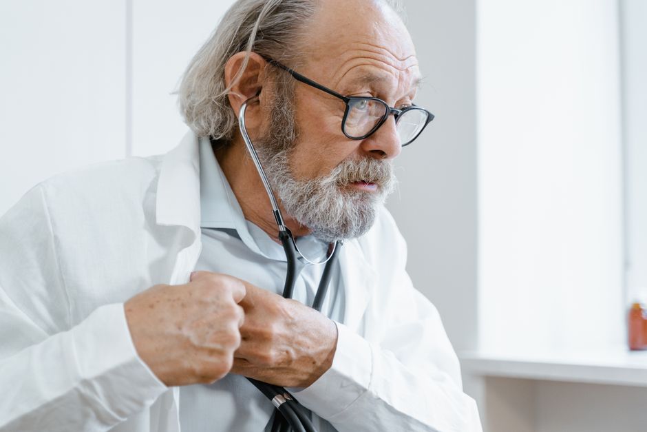 elderly checking health with doctor