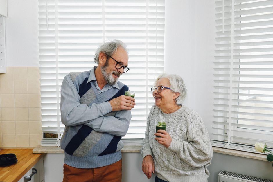 happy healthy elderly korean couple at home