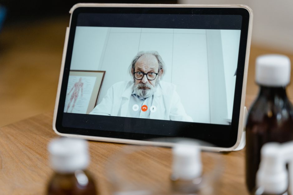 elderly patient talking to doctor