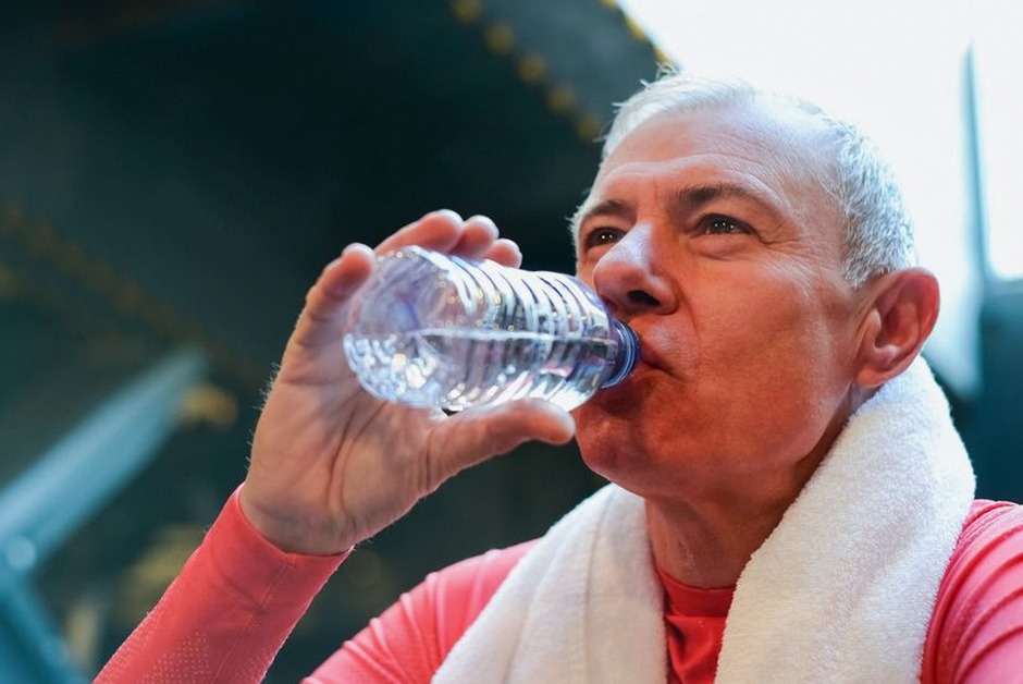 senior drinking water staying hydrated