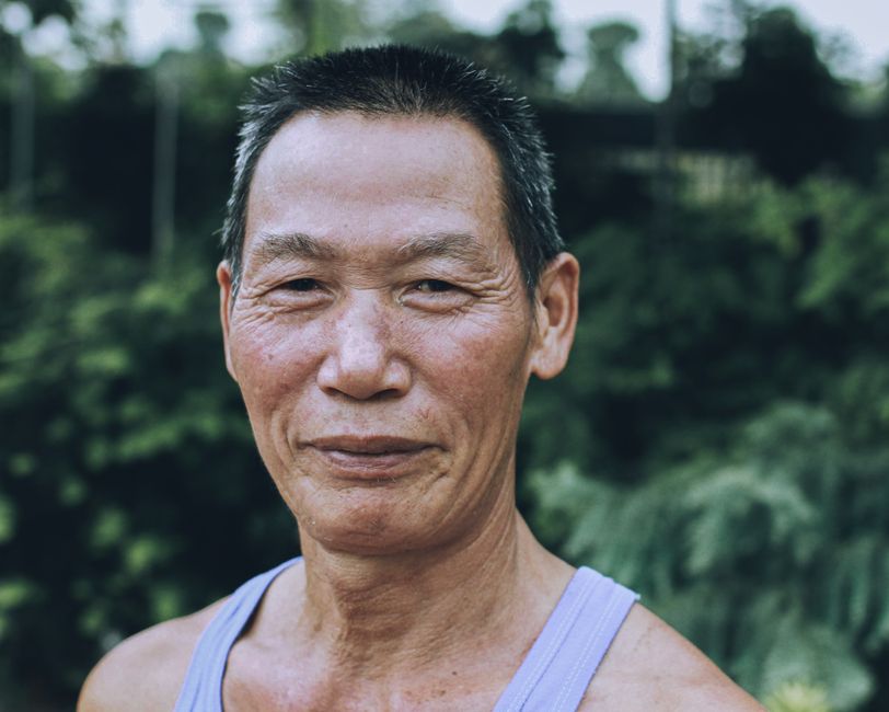 happy korean elderly person outdoors