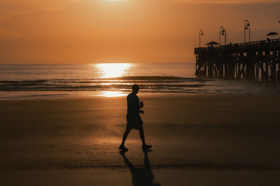 happy person walking sunset summer evening