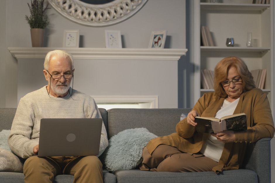 elderly couple staying cool indoors