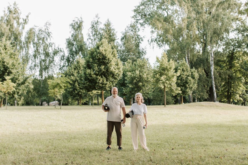 happy healthy senior couple summer park