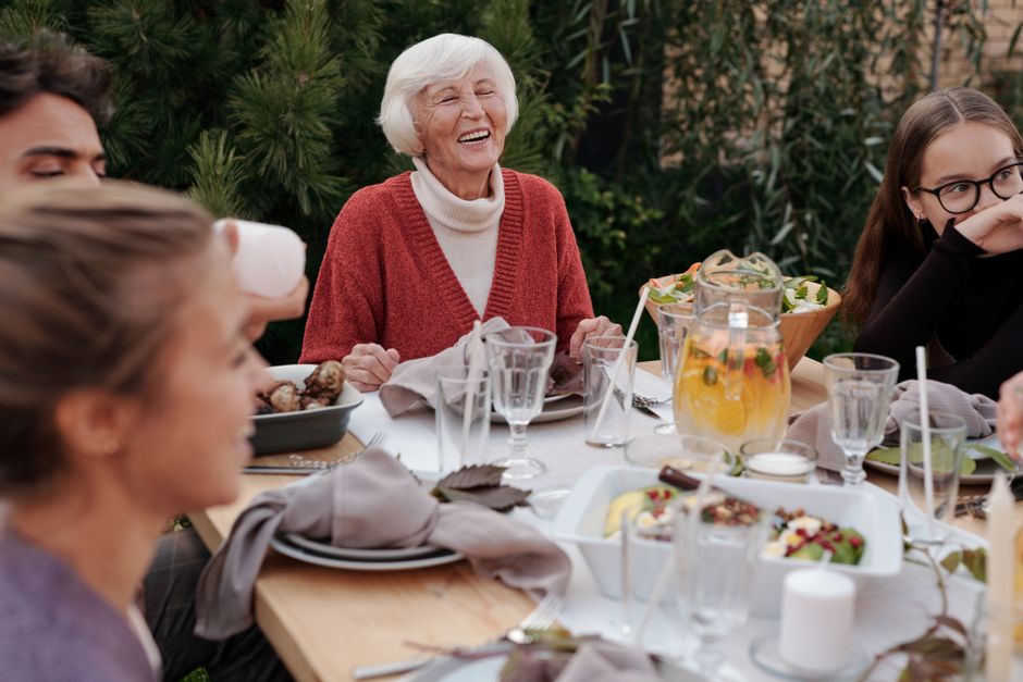 elderly family eating together happy
