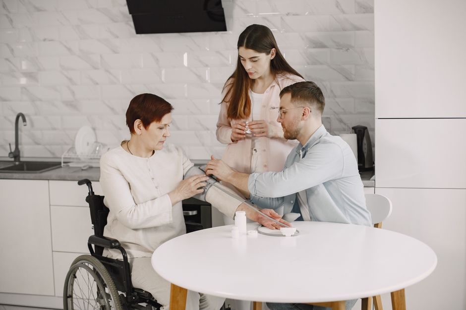 family checking on elderly parent