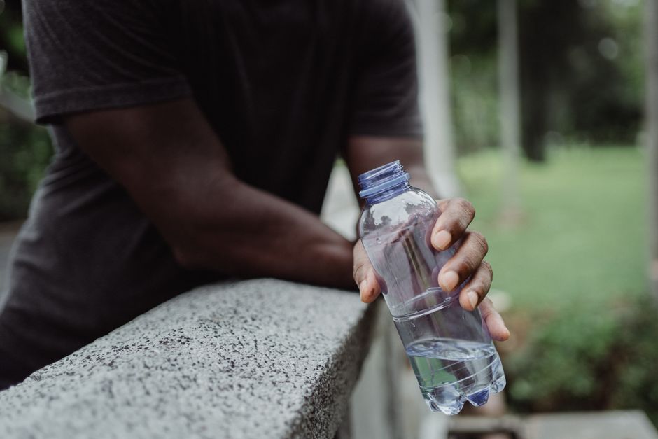 person drinking water staying hydrated summer