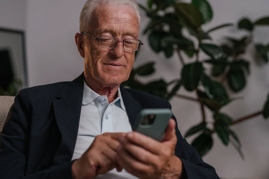 elderly person using smartphone
