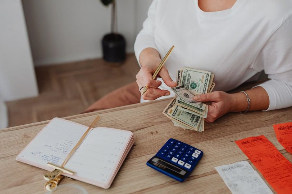 person calculating household budget