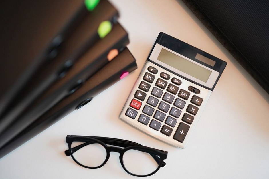 calculator and insurance papers finance