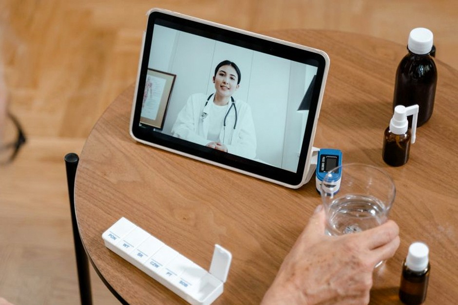 elderly person video calling on tablet
