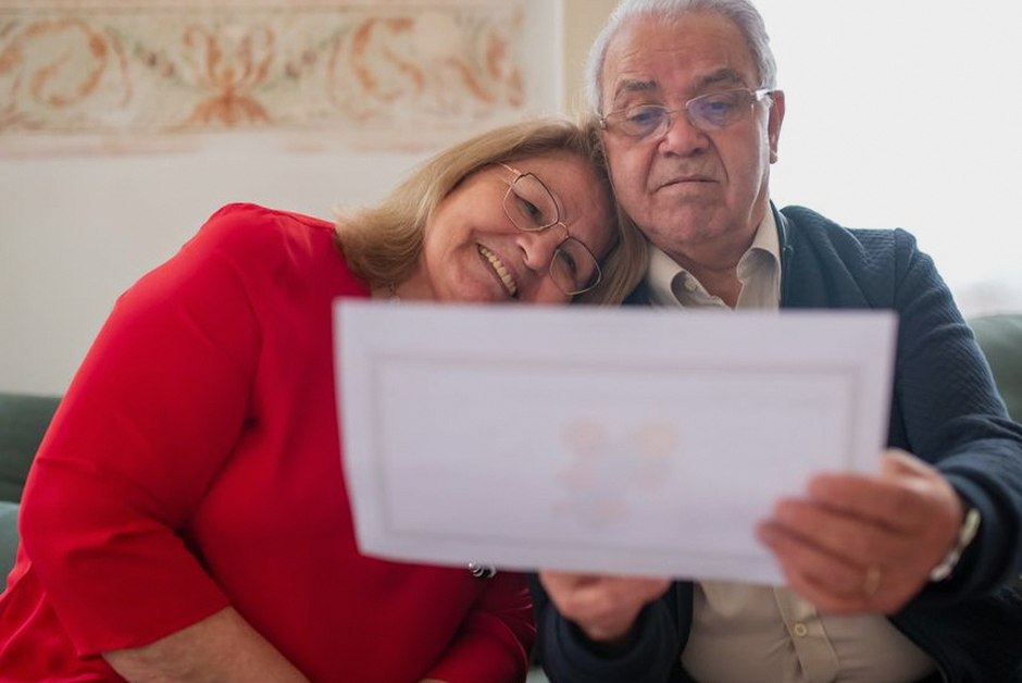 senior couple reviewing insurance documents