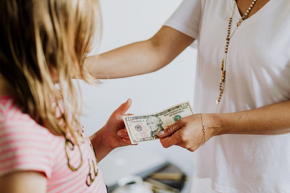 korean parents giving money to adult child