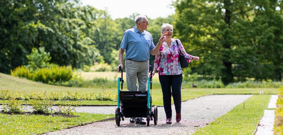 elderly couple walking exercise park