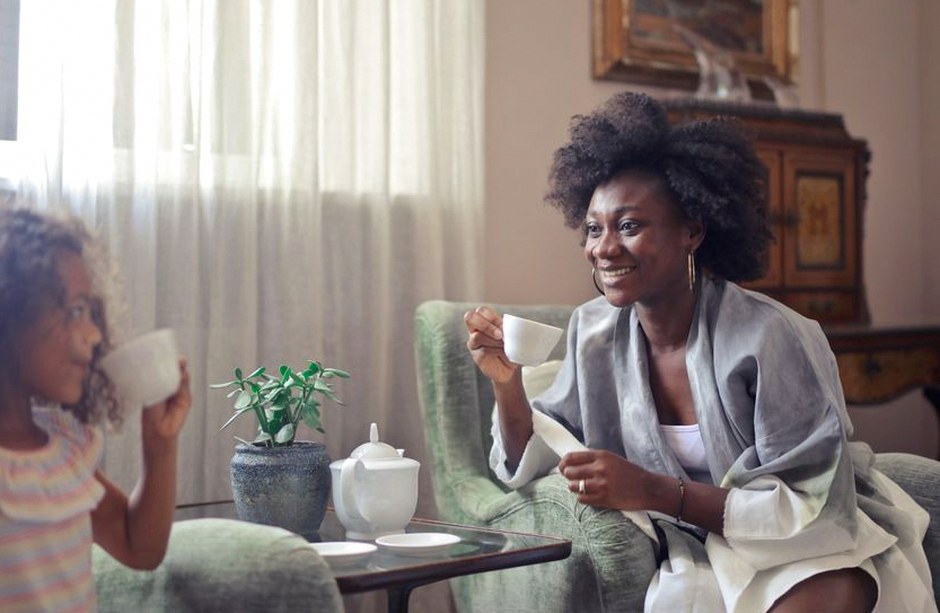 parent and adult child having tea conversation