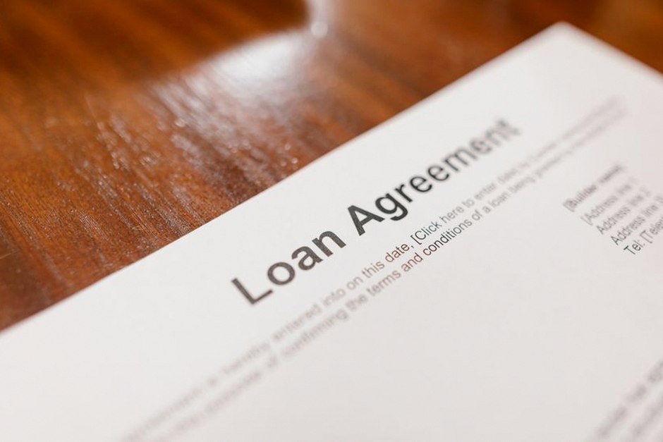 signing loan contract document