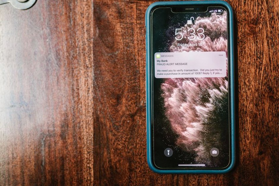 suspicious text message scam phone screen