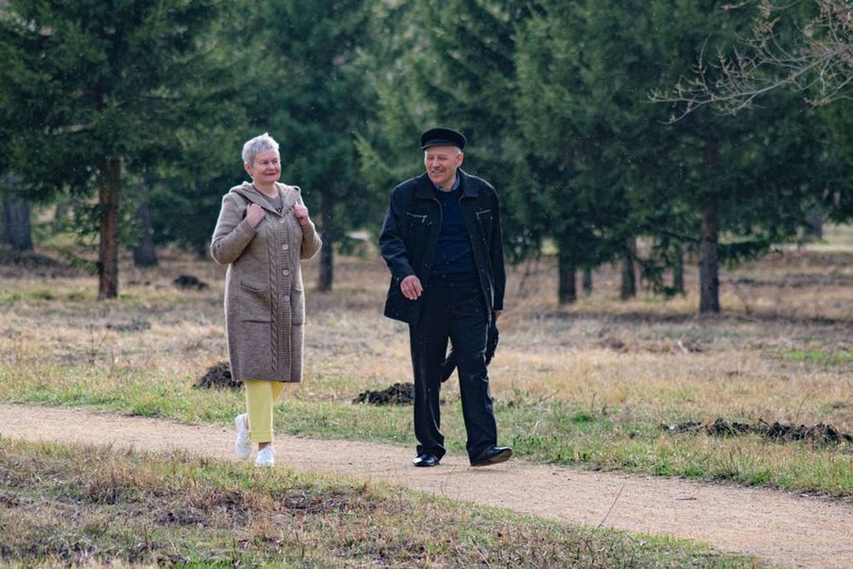 senior couple walking outdoors exercise