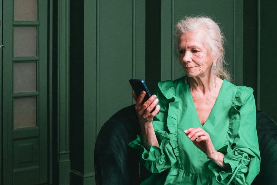 senior woman using smartphone community app