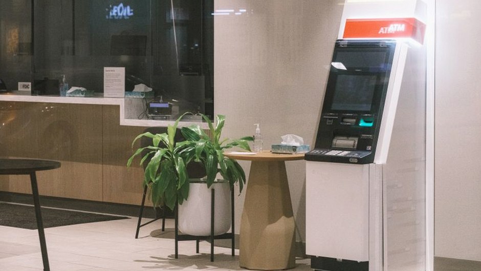 bank teller helping customer