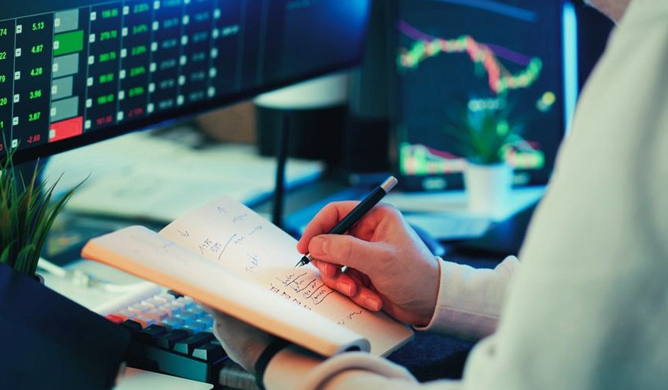 person calmly reviewing investment plan notebook