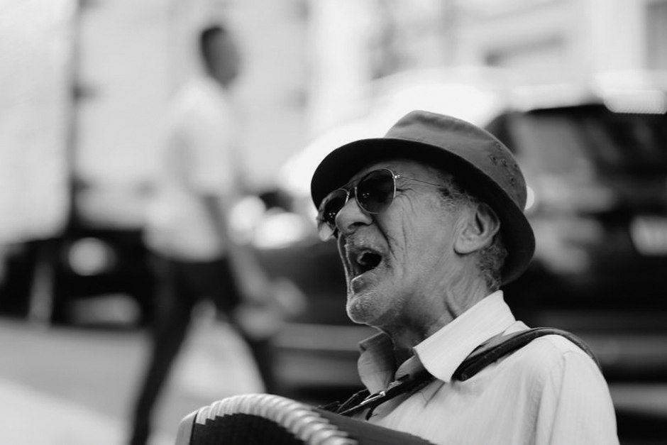 elderly person singing trot music with radio