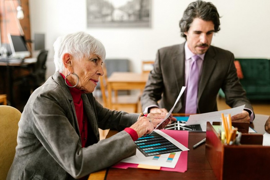 elderly person consulting with social worker