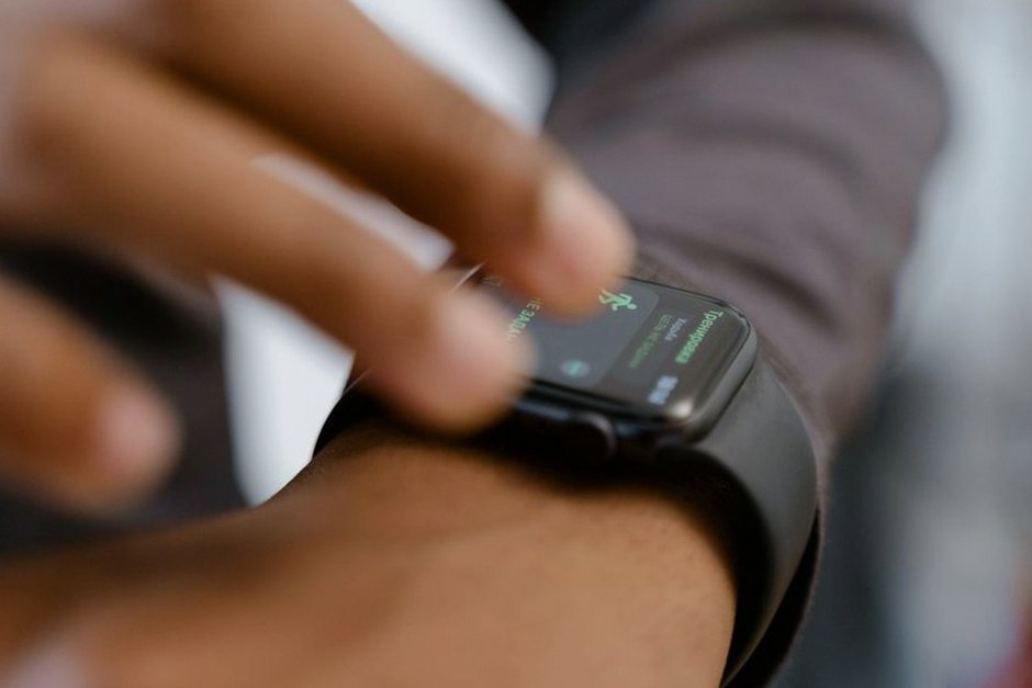 elderly person wearing smart watch health monitor