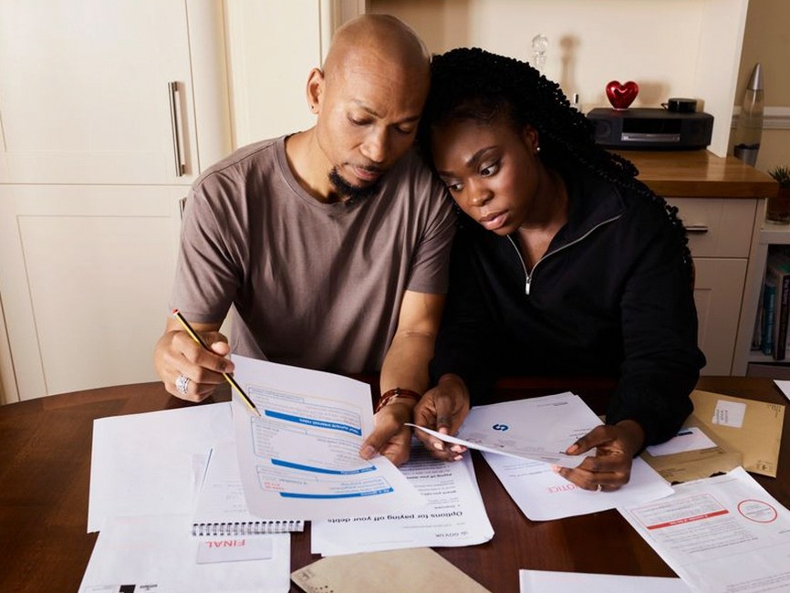 family discussing medical bills paperwork