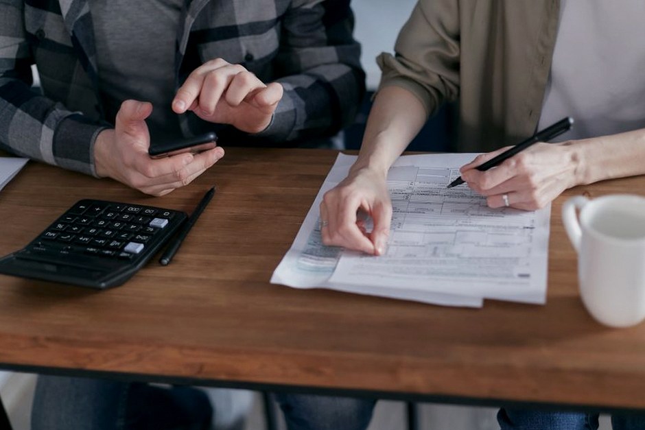 calculator tax documents desk
